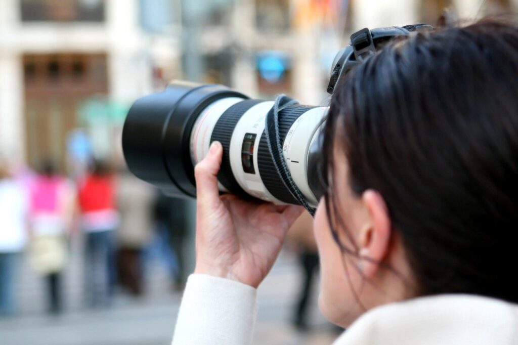 Photo: Journalist Taking A Photograph